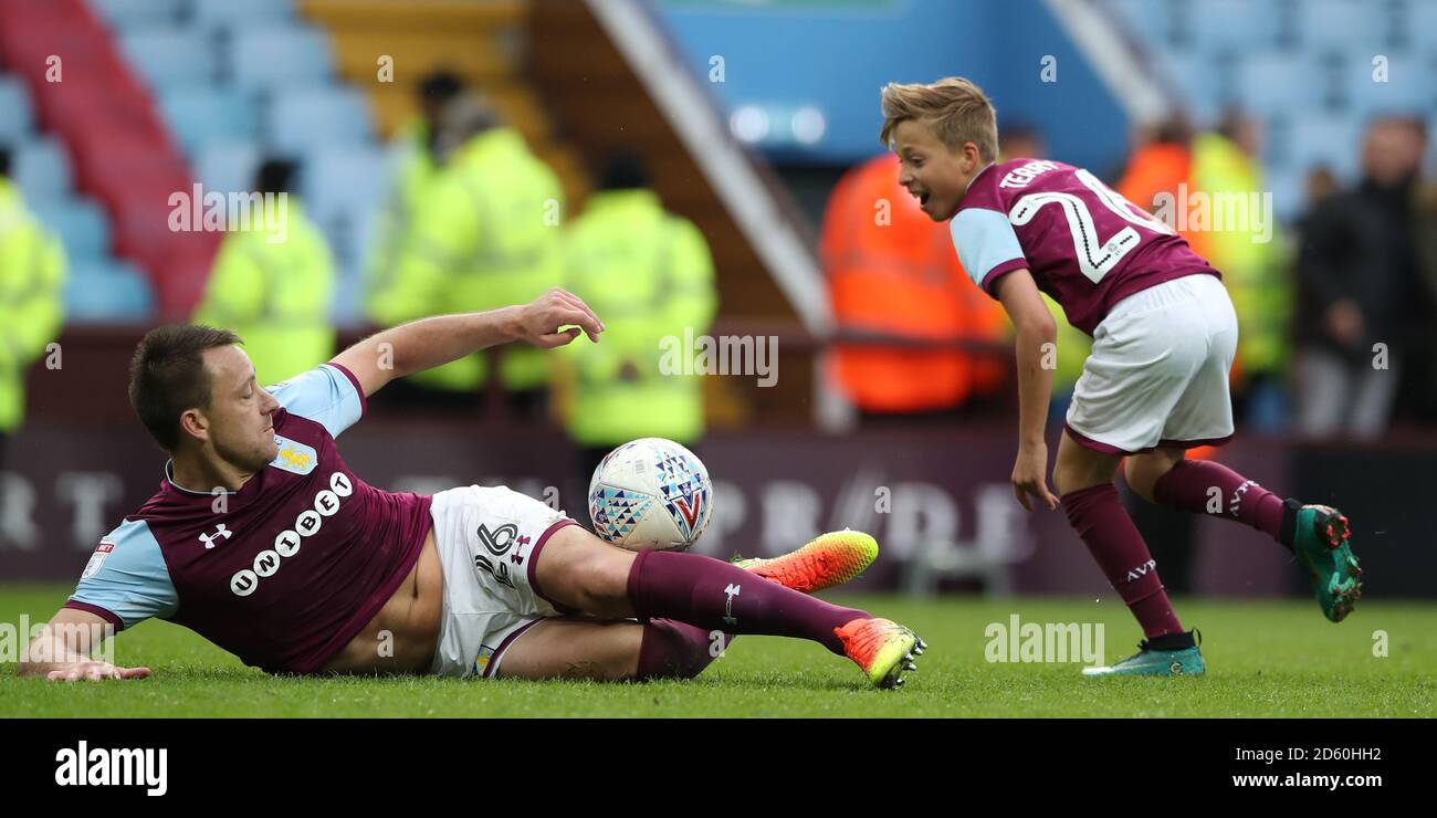 Aston Villa's John Terry slide tackles his son Georgie Terry after the game against Derby County  Stock Photo
