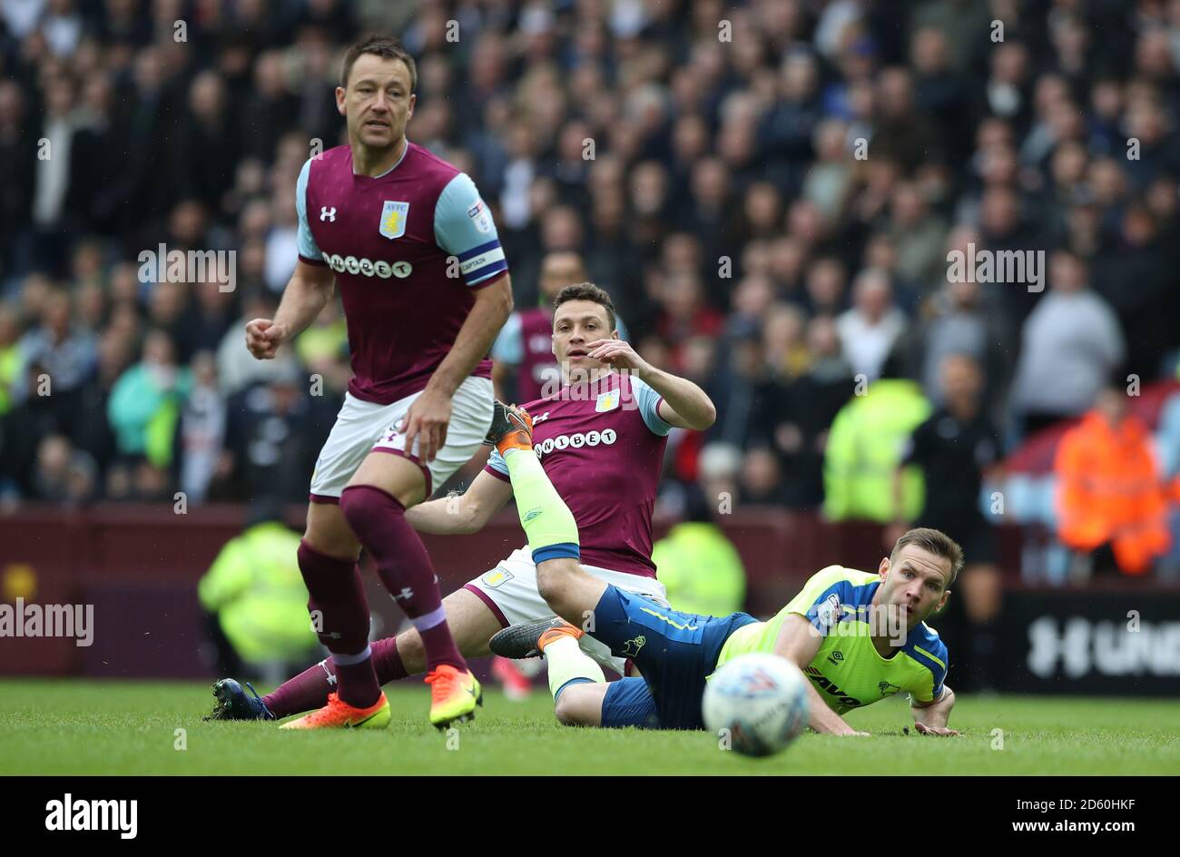 Derby County's Andreas Weimann wins battle for the ball against Aston Villa's John Terry and Aston Villa's James Chester  Stock Photo