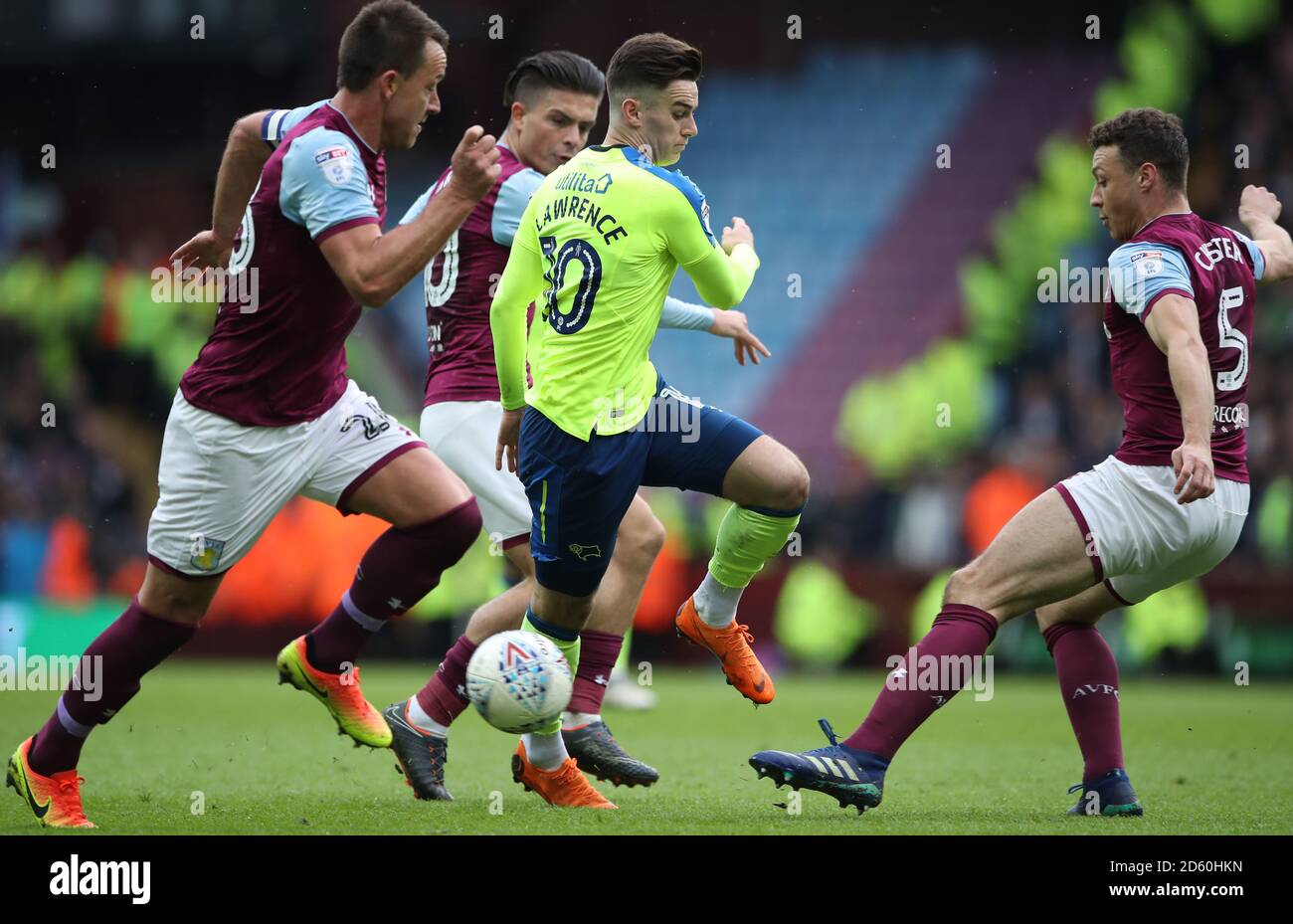 Derby County's Tom Lawrence holds off challenges from Aston Villa's John Terry and Aston Villa's Jack Grealish but is tackled by Aston Villa's James Chester  Stock Photo