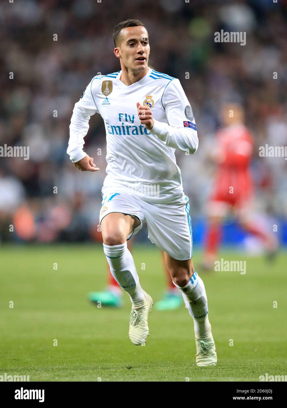Lucas Vazquez celebrates a goal or victory for Real Madrid, arms raised in triumph