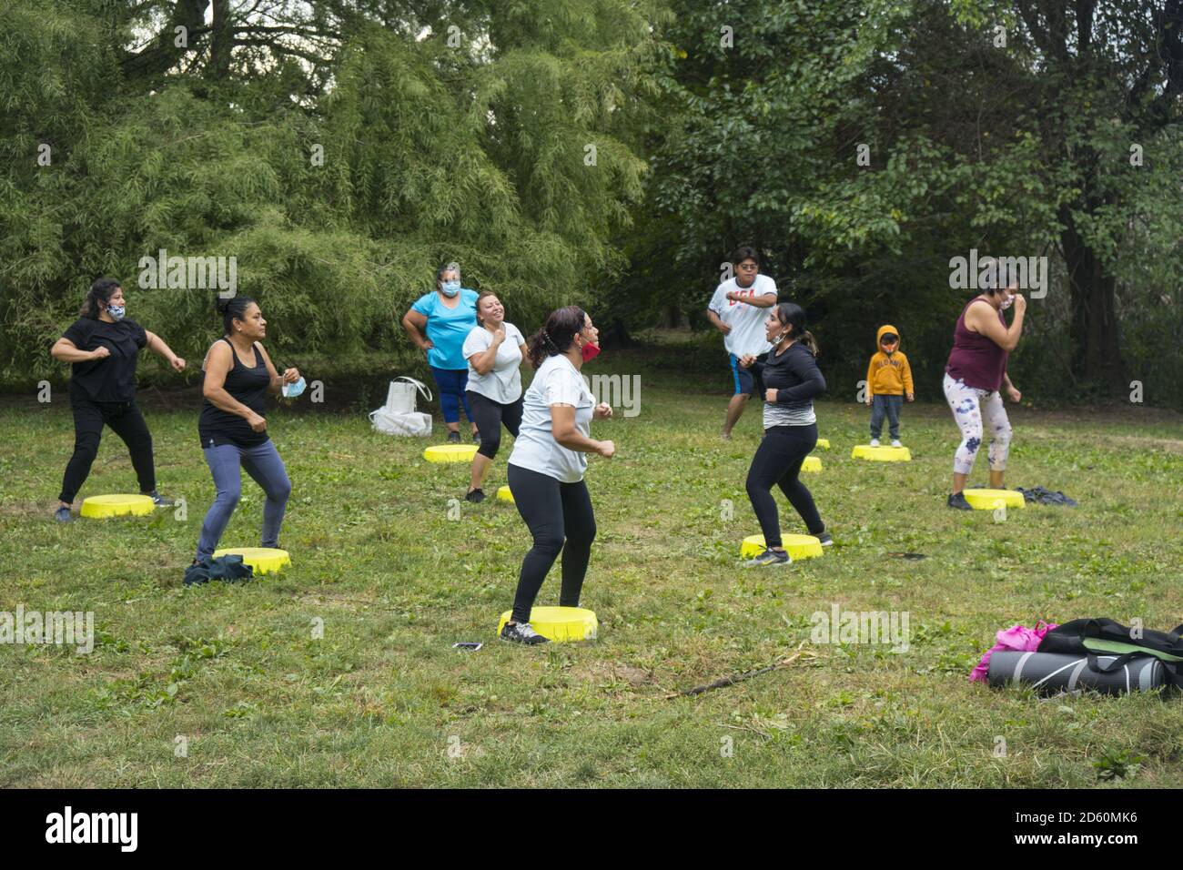 Exercise group of Hispanic women during the Covid-19 pandemic in Prospect Park, Brooklyn, New York. Stock Photo