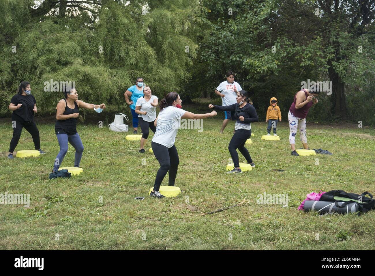 Exercise group of Hispanic women during the Covid-19 pandemic in Prospect Park, Brooklyn, New York. Stock Photo