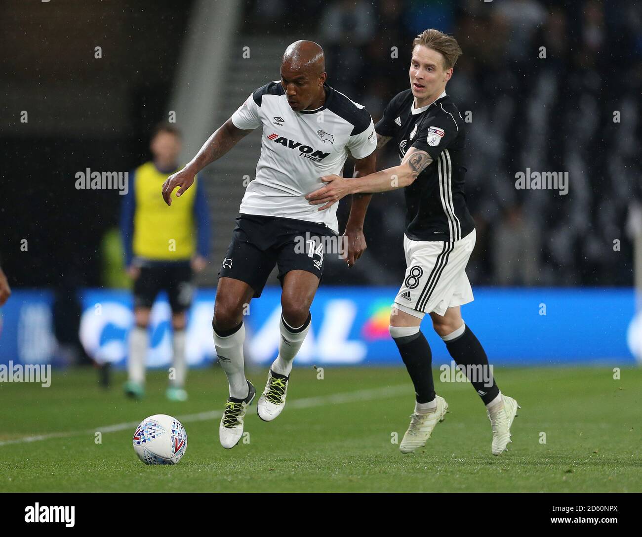 Derby County's Andre Wisdom (left) and Fulham's Stefan Johansen during the match at Pride Park Stadium Stock Photo