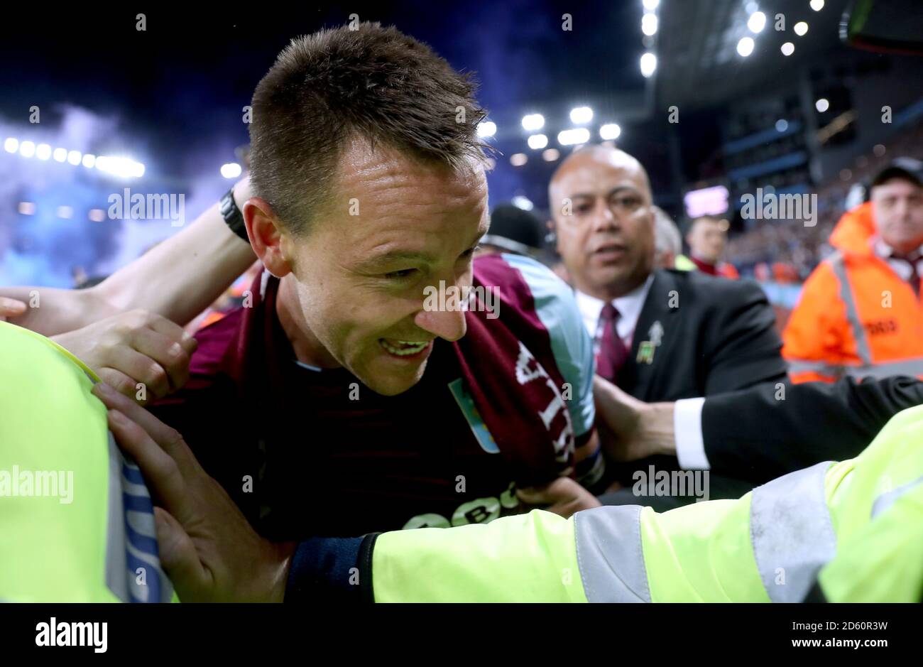 Aston Villa's John Terry is lead off the pitch by stewards at the end of the Sky Bet Championship Playoff match at Villa Park, Birmingham Stock Photo