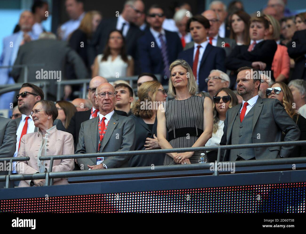 Sir Bobby Charlton (2nd left) with wife Norma Ball (left), Manchester United chief executive Ed Woodward (right) Stock Photo