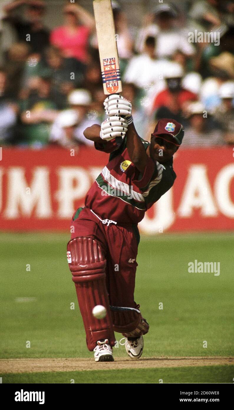 West Indies' Brian Lara hits a boundary off the bowling of Zimbabwe's Guy Whittall  Stock Photo