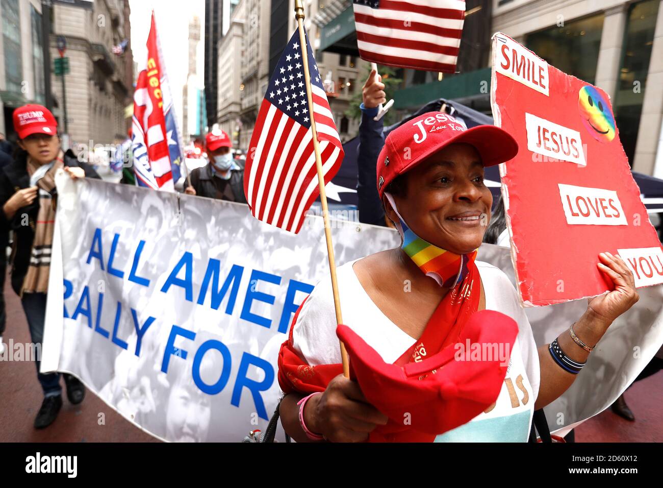 New York, United States. 13th Oct, 2020. Trump supporters march on Fifth Avenue while holding a banner to Times Square as contentious political and judicial topics are being debated in Washington DC. Issues concerning the health of the President and optimism of his re-election resounded among the rally participants. Credit: SOPA Images Limited/Alamy Live News Stock Photo