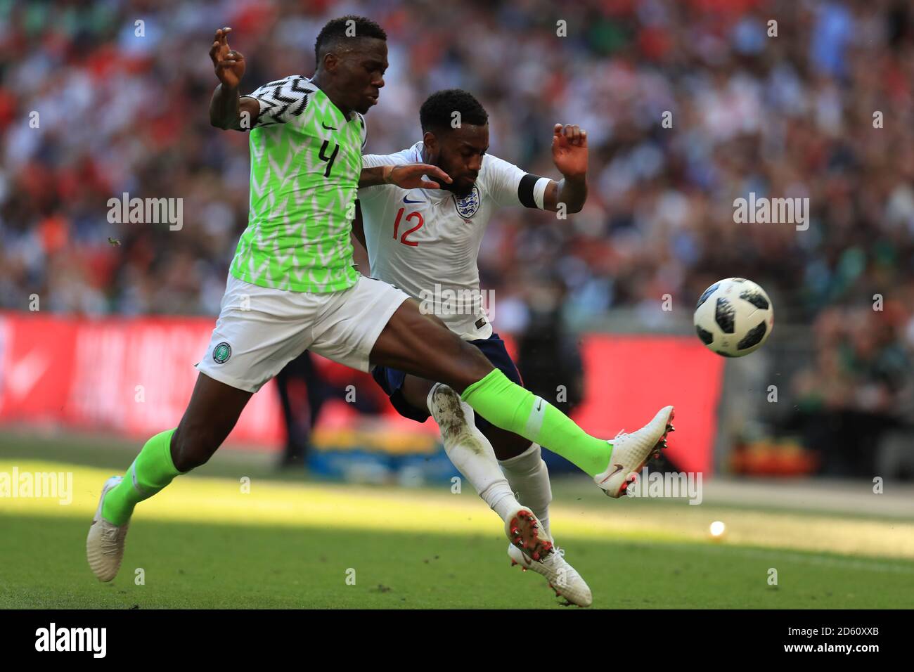 England's Danny Rose (right) and Nigeria's Kenneth Omeruo battle for the ball Stock Photo