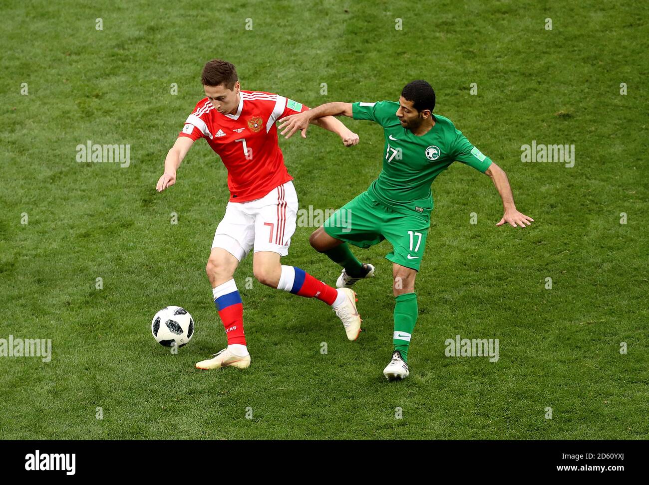 Russia's Daler Kuzyayev (left) and Saudi Arabia's Taisir Al-Jassim battle for the ball Stock Photo