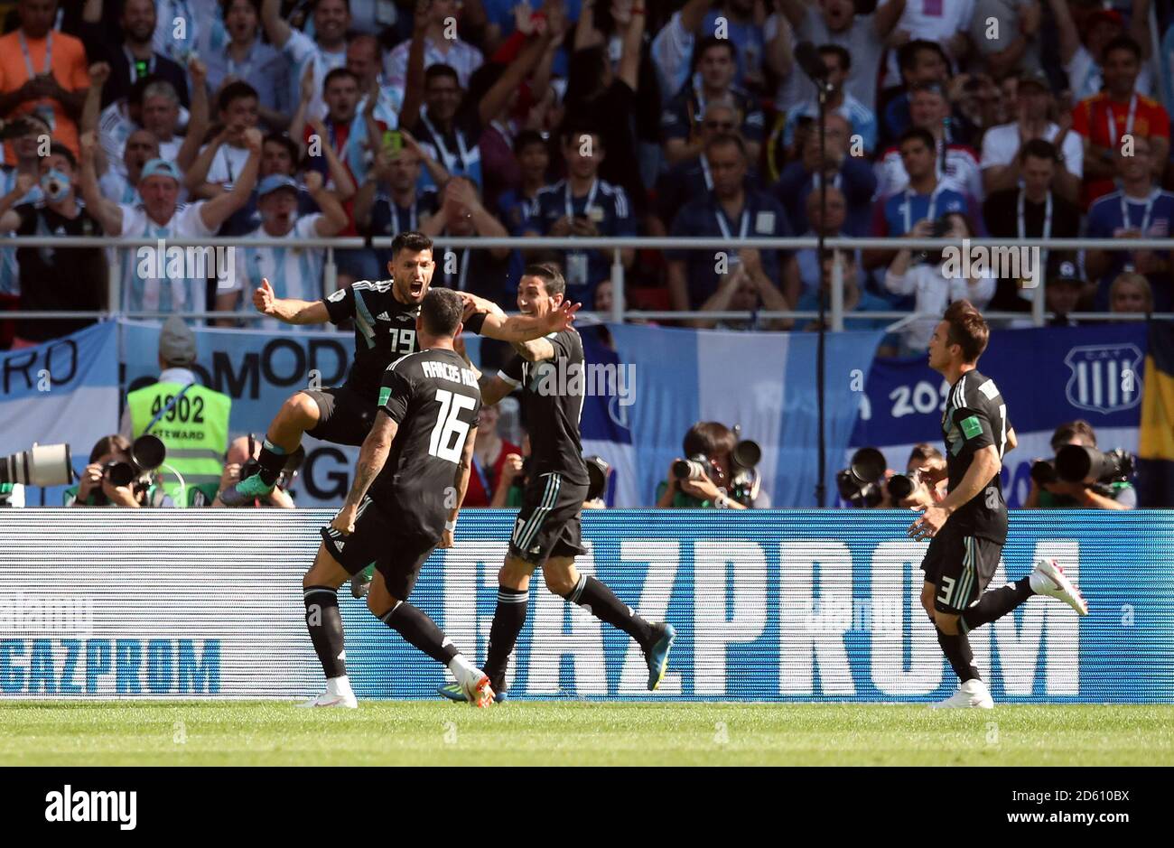 Argentina's Sergio Aguero (left) celebrates scoring his side's first goal of the game with his team-mates Stock Photo