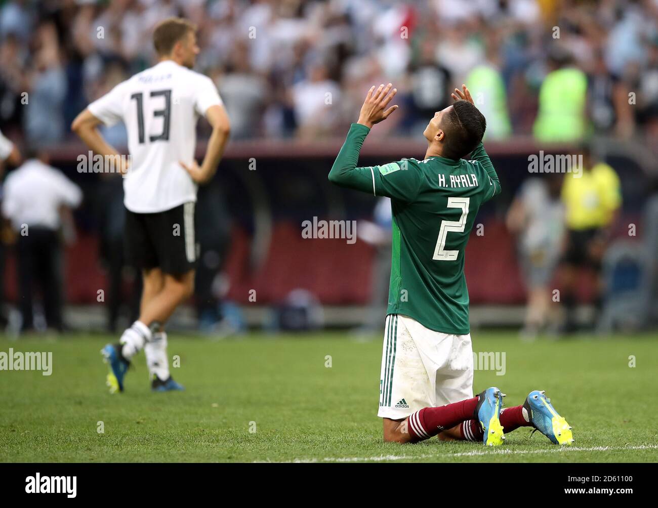 Mexico's Hugo Ayala (right) celebrates with Germany's Thomas Muller looking dejected Stock Photo