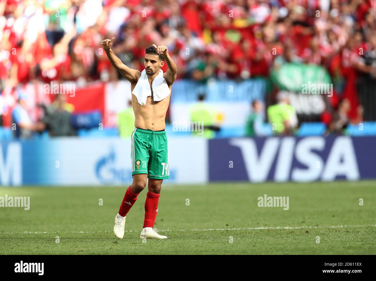 Mbark Morocco's Mbark Boussoufa salutes the fans after the game as his side ...