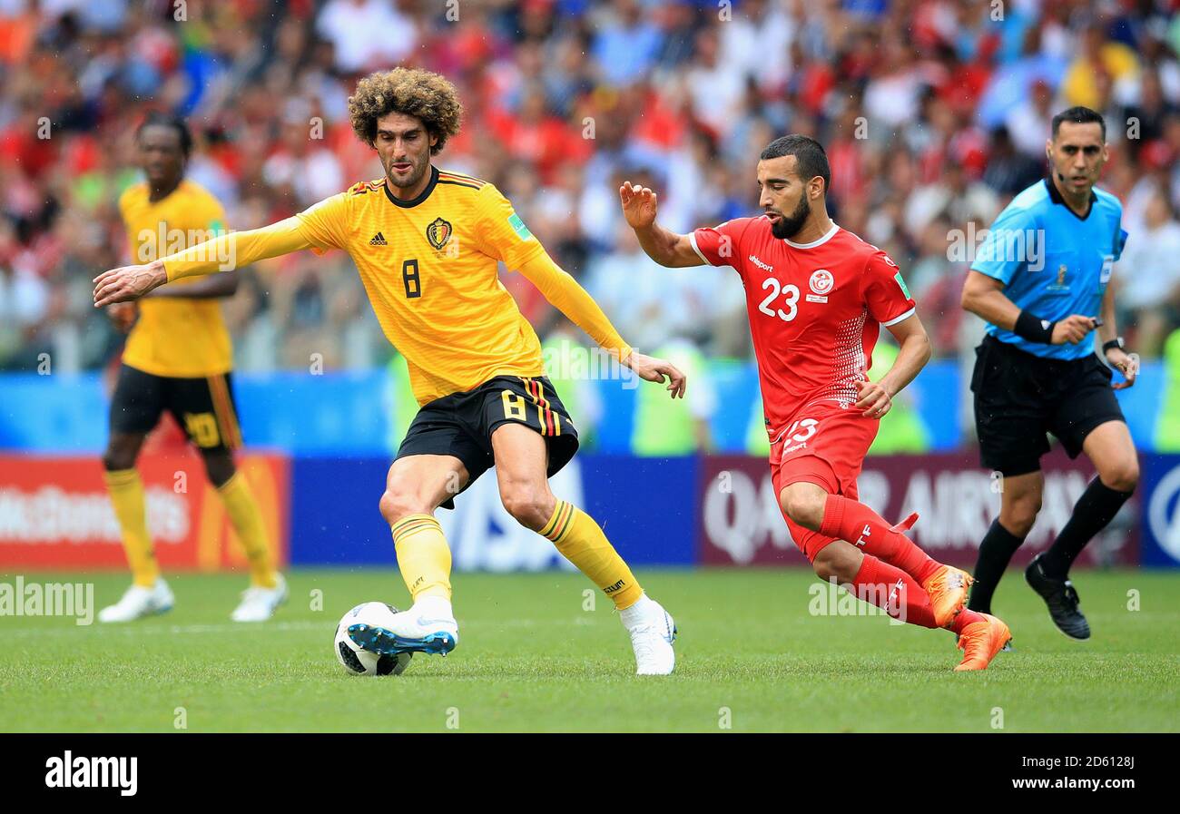 Belgium's Marouane Fellaini (left) and Tunisia's Naim Sliti battle for the ball Stock Photo