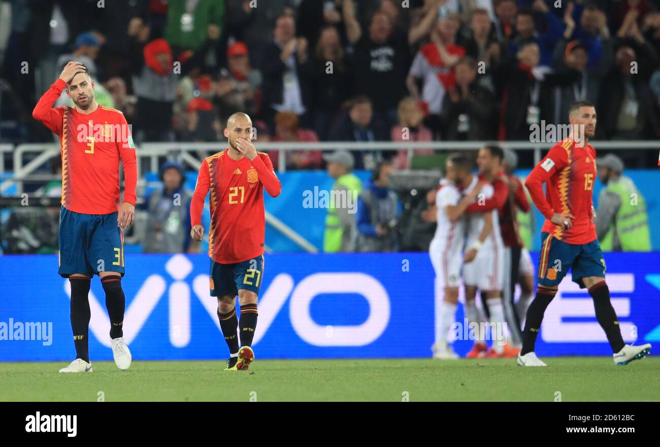 Spain's Gerard Pique (left) appears dejected after Morocco's Youssef En-Nesyri scores his side's second goal of the game Stock Photo