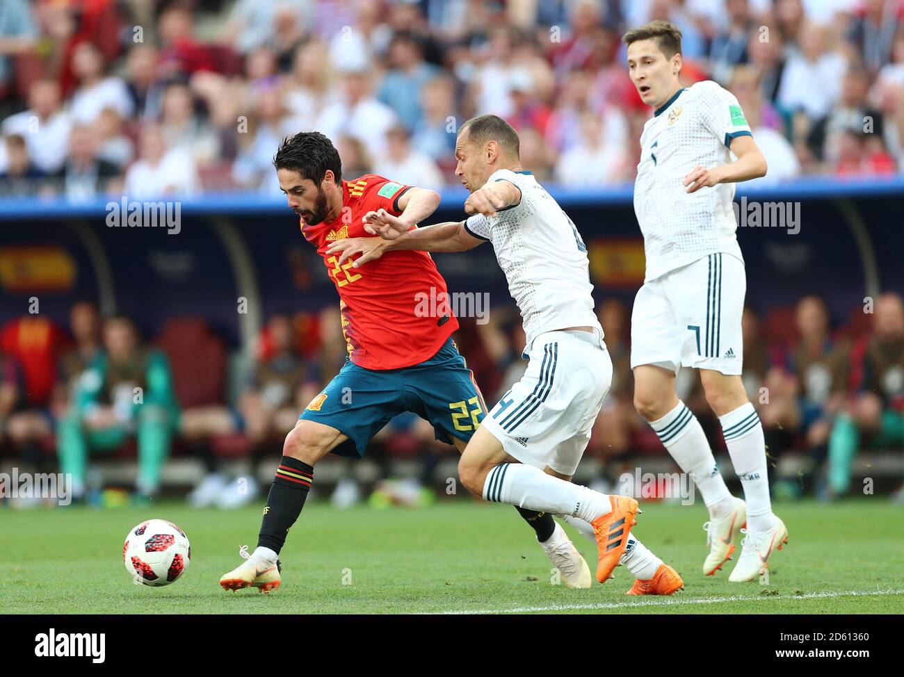 Spain's Isco (left) and Russia's Sergei Ignashevich battle for the ball Stock Photo