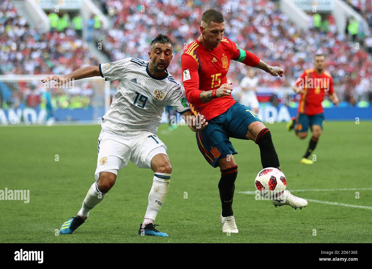 Russia's Aleksandr Samedov (left) and Spain's Sergio Ramos battle for the ball Stock Photo