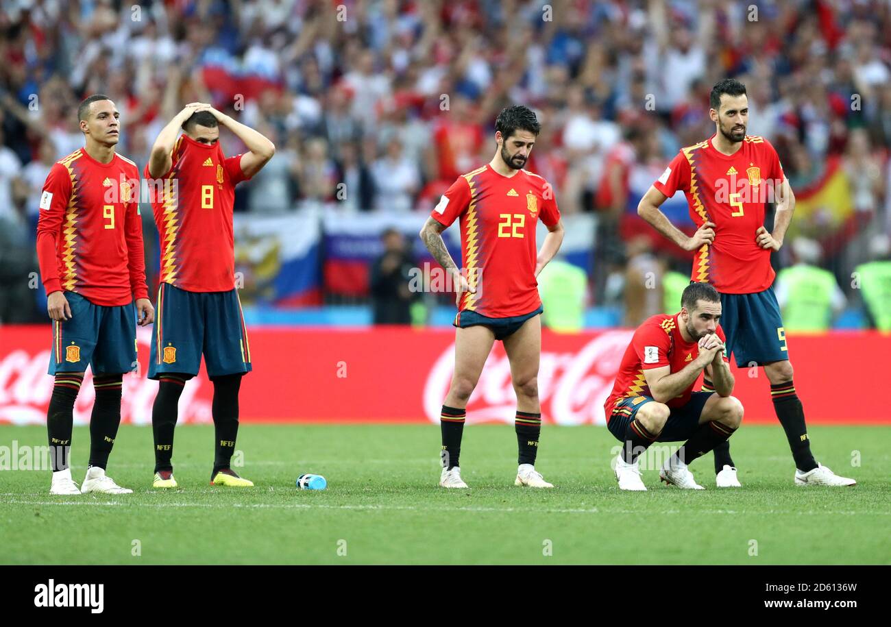 Spain's Rodrigo, Koke, Isco, Dani Carvajal, Sergio Busquets, Iago Aspas, Gerard Pique and Andres Iniesta appear dejected after being defeated by Russia in a penalty shoot-out Stock Photo
