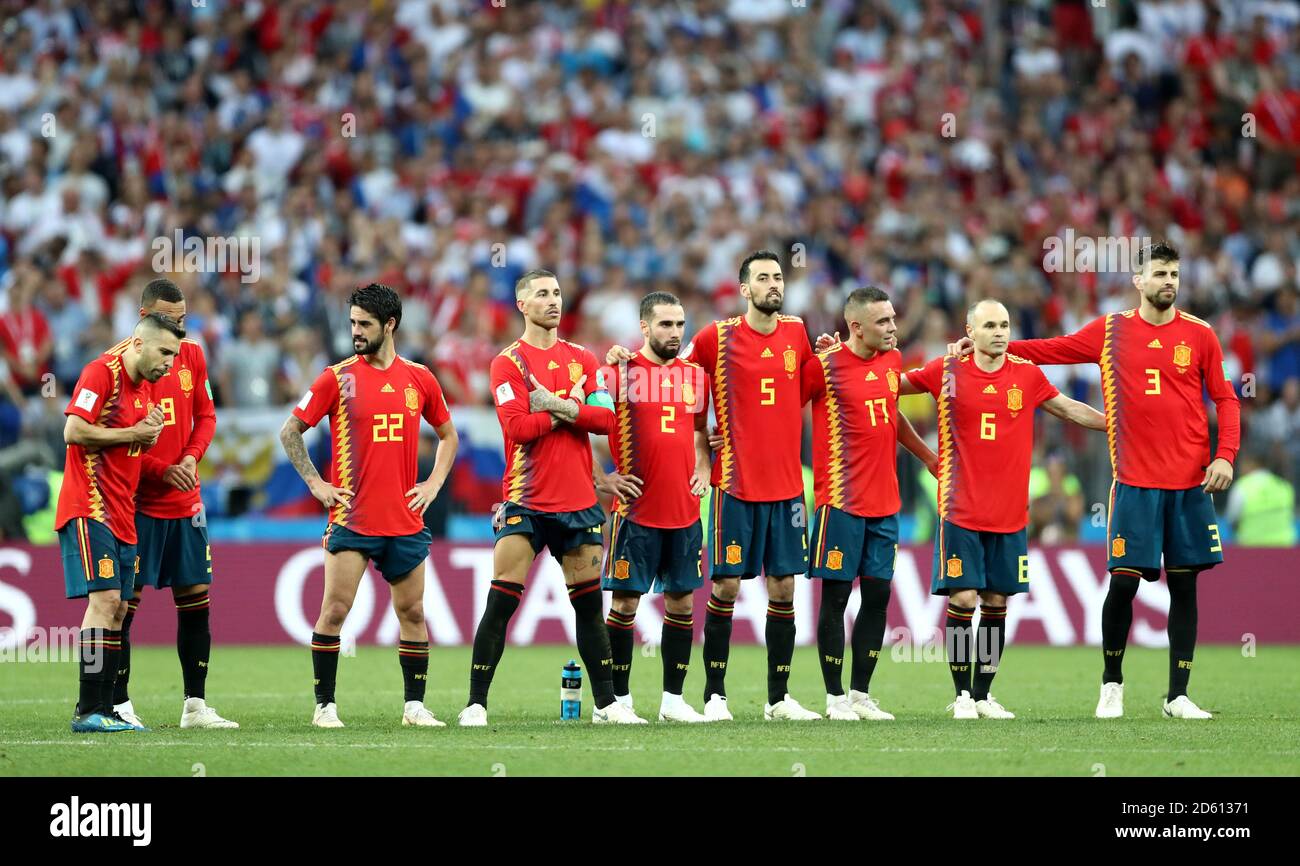 Spain's Rodrigo, Koke, Isco, Dani Carvajal, Sergio Busquets, Iago Aspas, Gerard Pique, Andres Iniesta and Gerard Pique appear dejected after being defeated by Russia in a penalty shoot-out Stock Photo