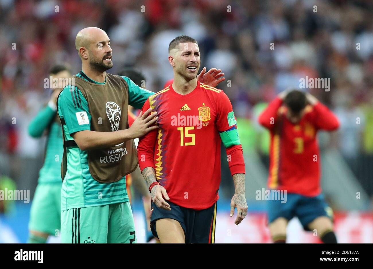 Spain goalkeeper Pepe Reina commiserates with team-mate Sergio Ramos after the final whistle Stock Photo