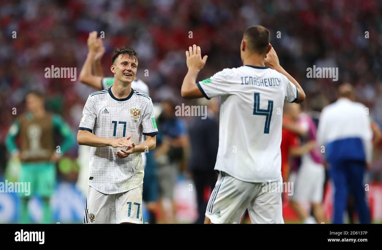 Russia's Aleksandr Golovin (left) and Russia's Sergei Ignashevich celebrate after the final whistle Stock Photo