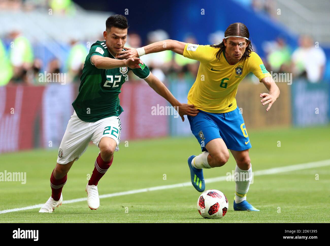 Mexico's Hugo Ayala (left) and Brazil's Filipe Luis battle for the ball Stock Photo