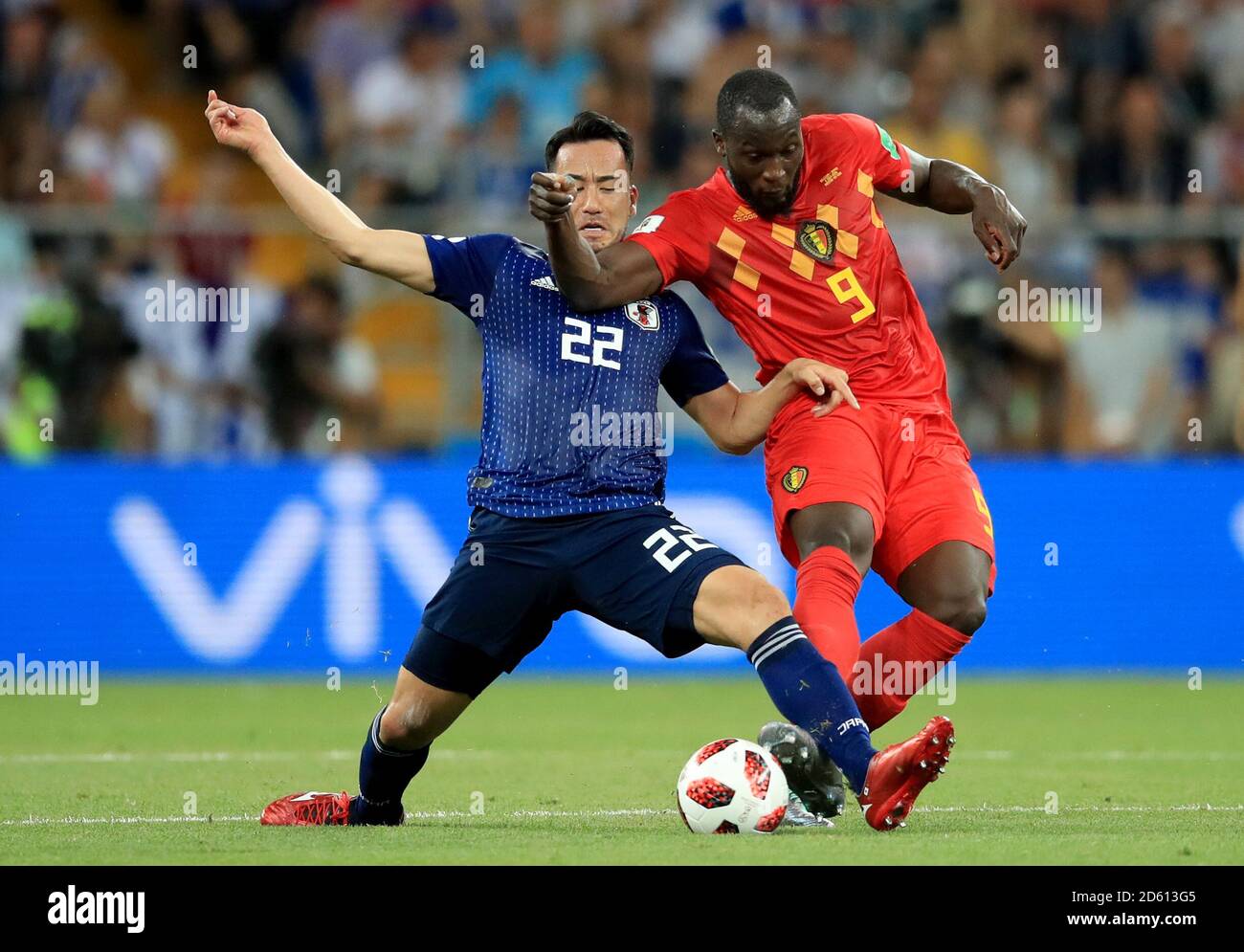 Japan's Maya Yoshida (left) and Belgium's Romelu Lukaku battle for the ball Stock Photo