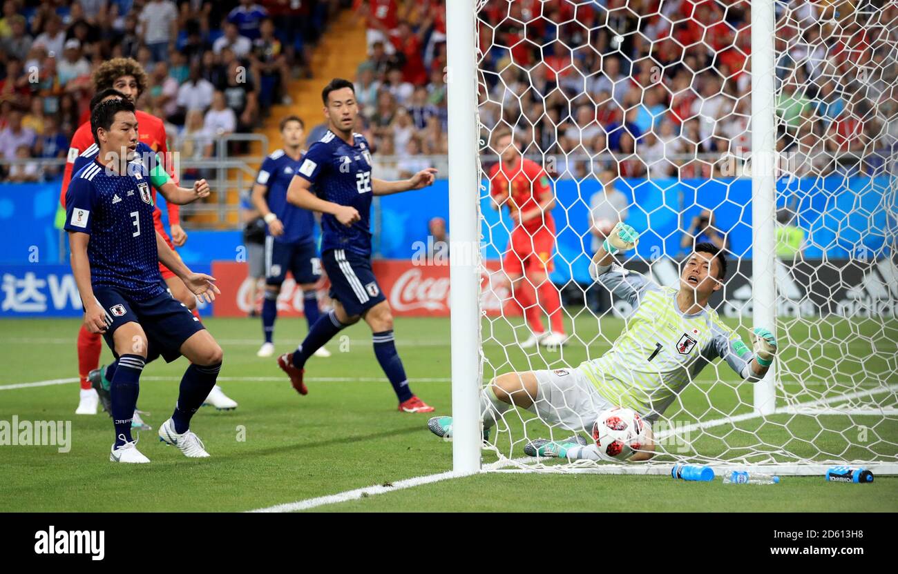 Belgium's Jan Vertonghen (obscured) scores his side's first goal of the game as Japan goalkeeper Eiji Kawashima (right) dives in vain Stock Photo