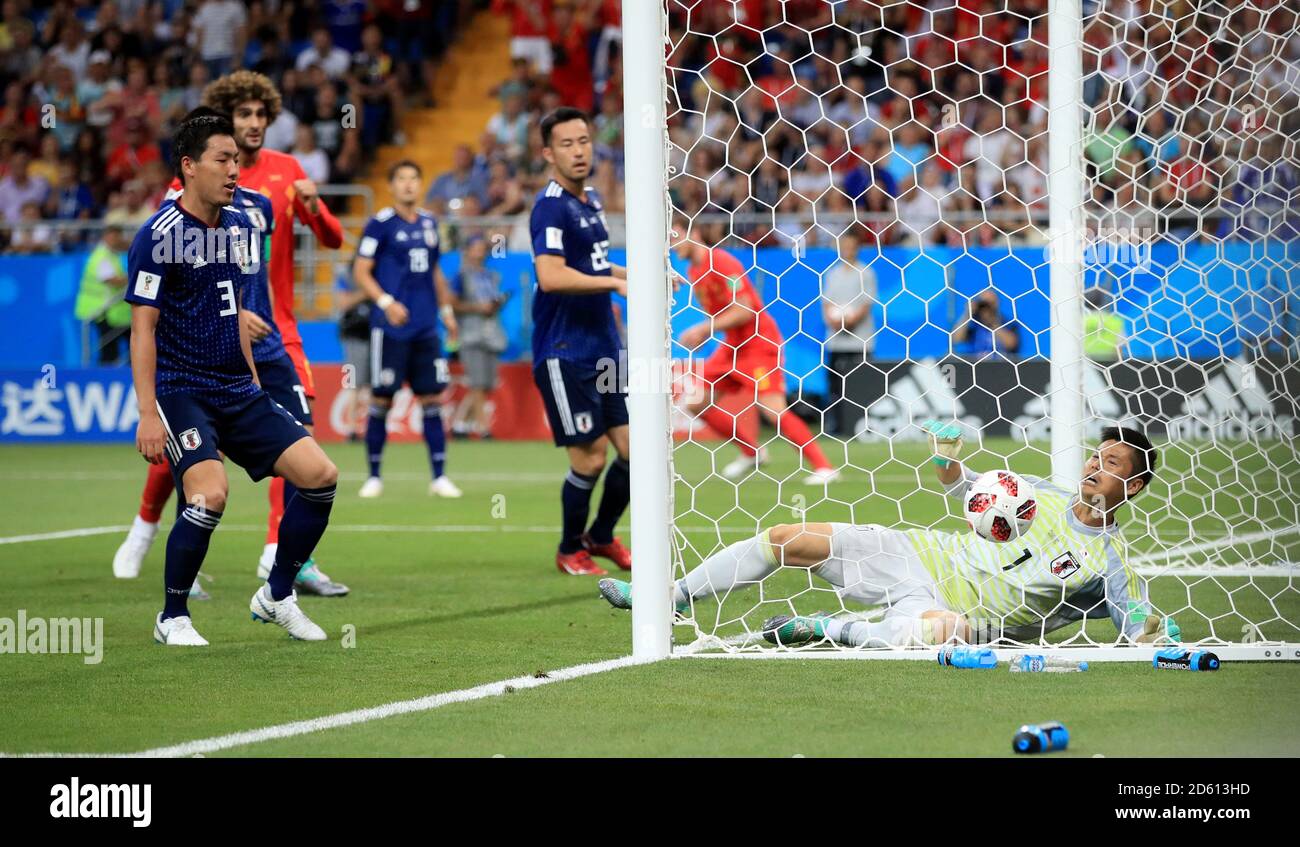 Belgium's Jan Vertonghen (obscured) scores his side's first goal of the game as Japan goalkeeper Eiji Kawashima (right) dives in vain Stock Photo