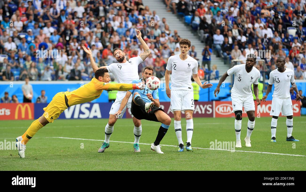 France goalkeeper Hugo Lloris punches clear from Uruguay's Cristhian Stuani Stock Photo