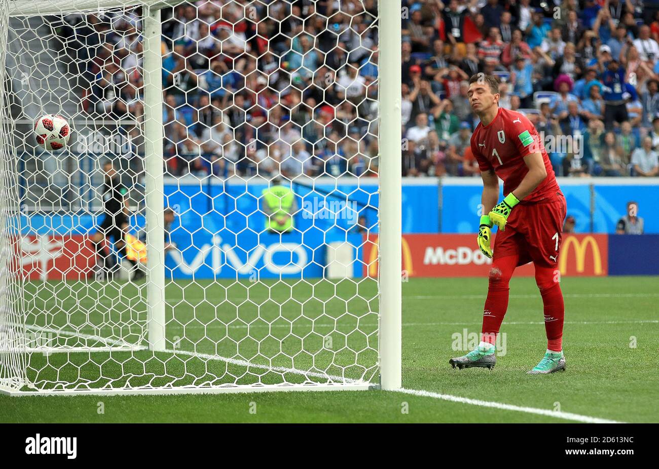 Uruguay goalkeeper Fernando Muslera looks dejected after letting the ball into his net as France score their second goal of the game Stock Photo