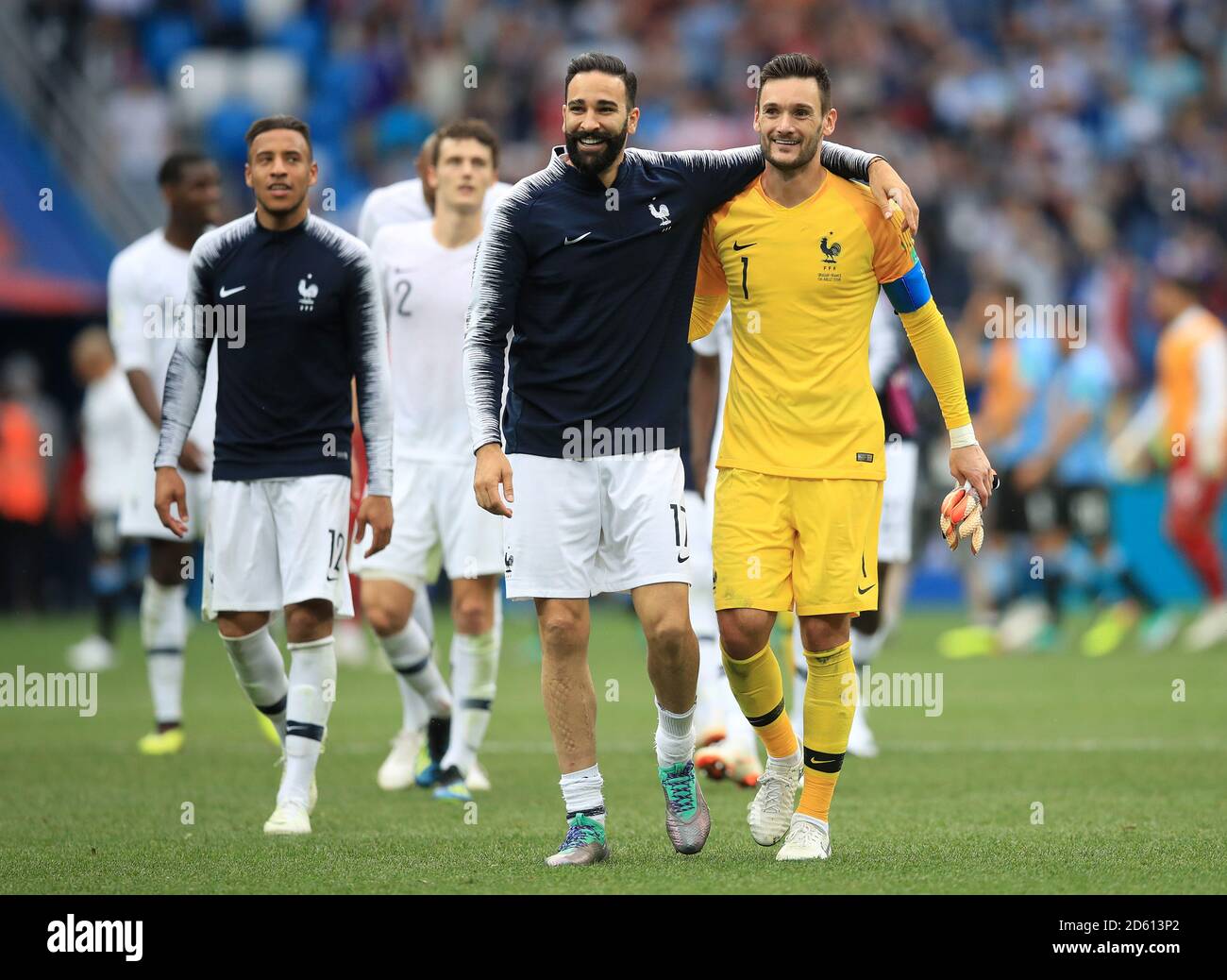 France's Adil Rami (centre) and goalkeeper Hugo Lloris celebrate after the game Stock Photo