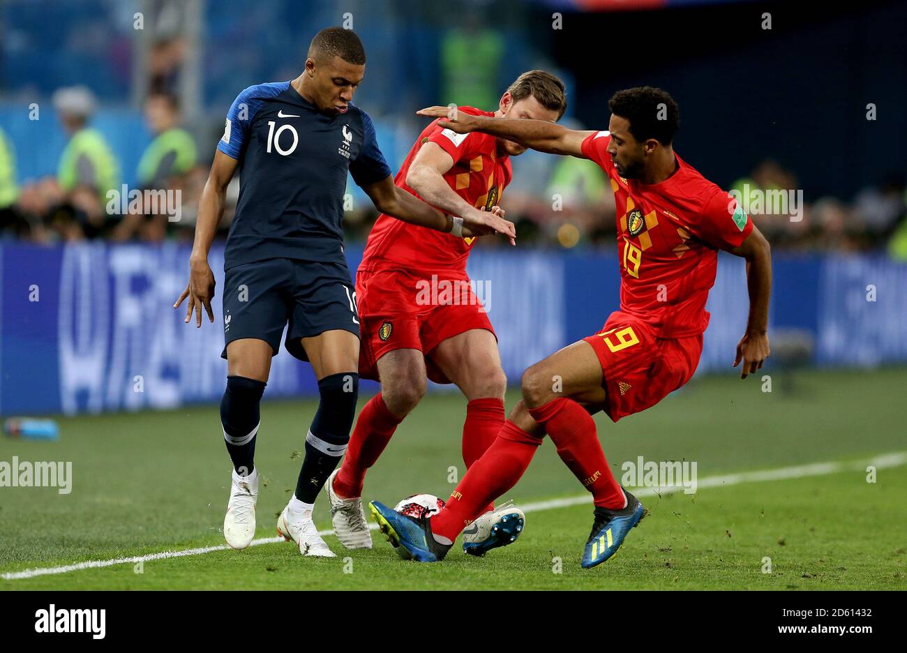 France's Kylian Mbappe (left) battles for the ball with Belgium's Jan Vertonghen (centre) and Belgium's Mousa Dembele (right) Stock Photo