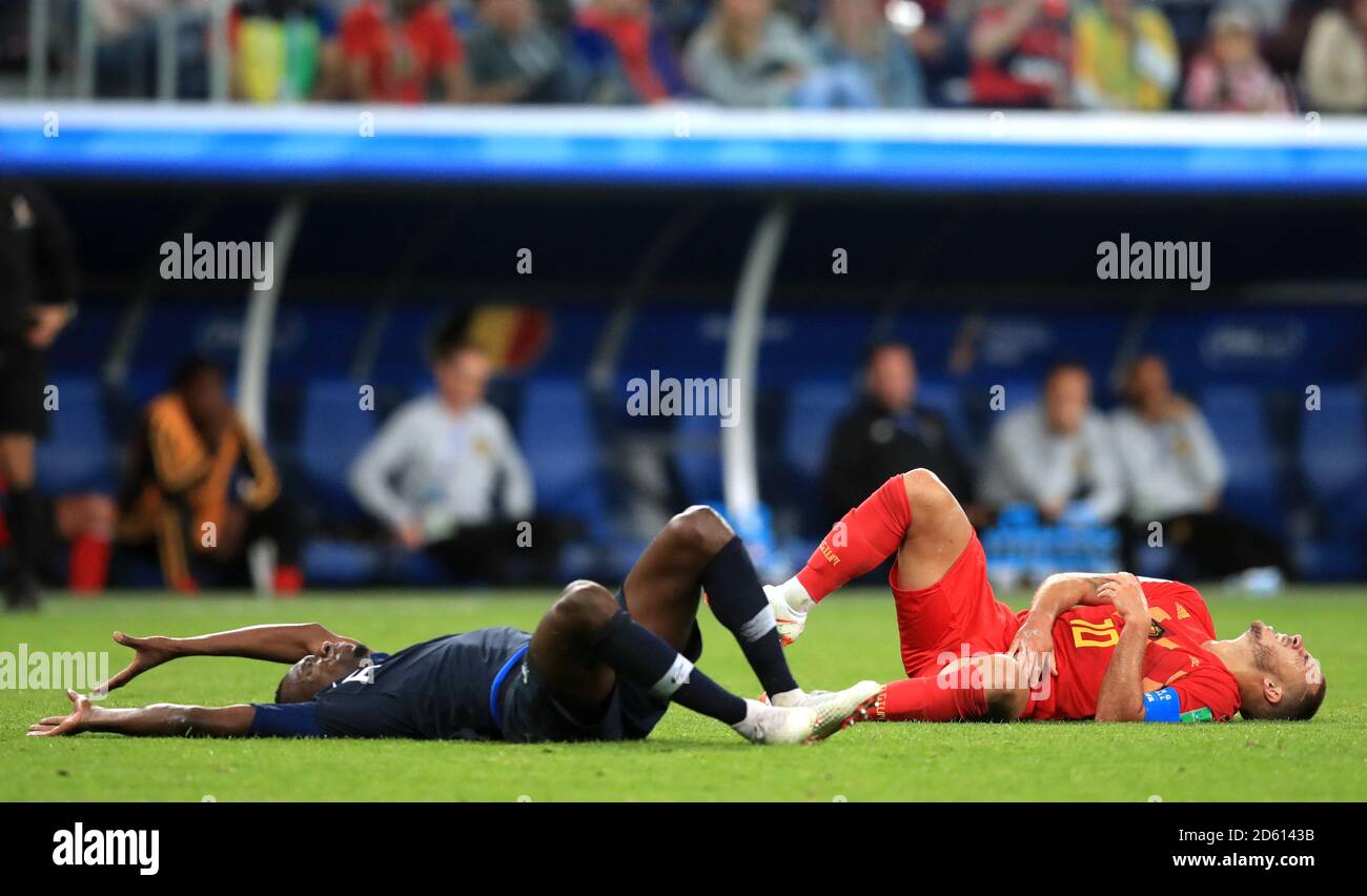 Belgium's Eden Hazard (right) reacts to a challenge from France's Paul Pogba (left) Stock Photo