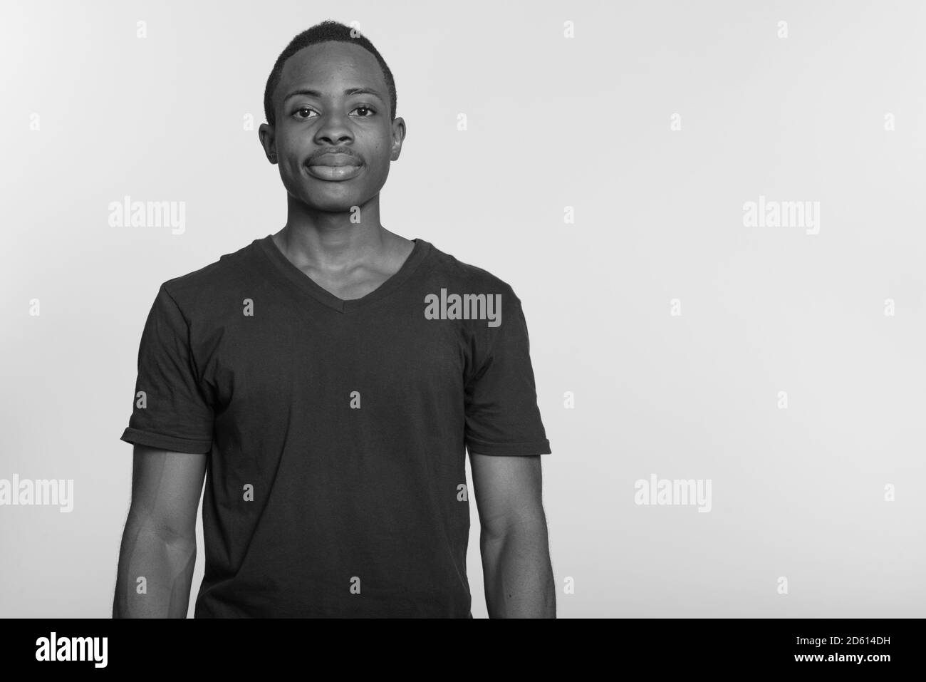 Portrait of young handsome African man looking at camera Stock Photo ...