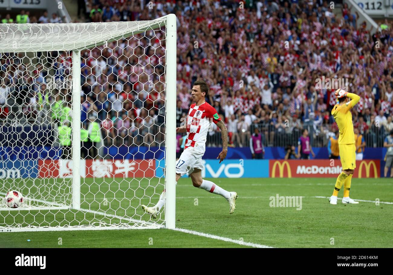 Croatia's Mario Mandzukic rushes to collect the ball after scoring his side's second goal as France goalkeeper Hugo Lloris stands dejected during the FIFA World Cup 2018 final at the Luzhniki Stadium in Moscow, 15th July 2018 Stock Photo