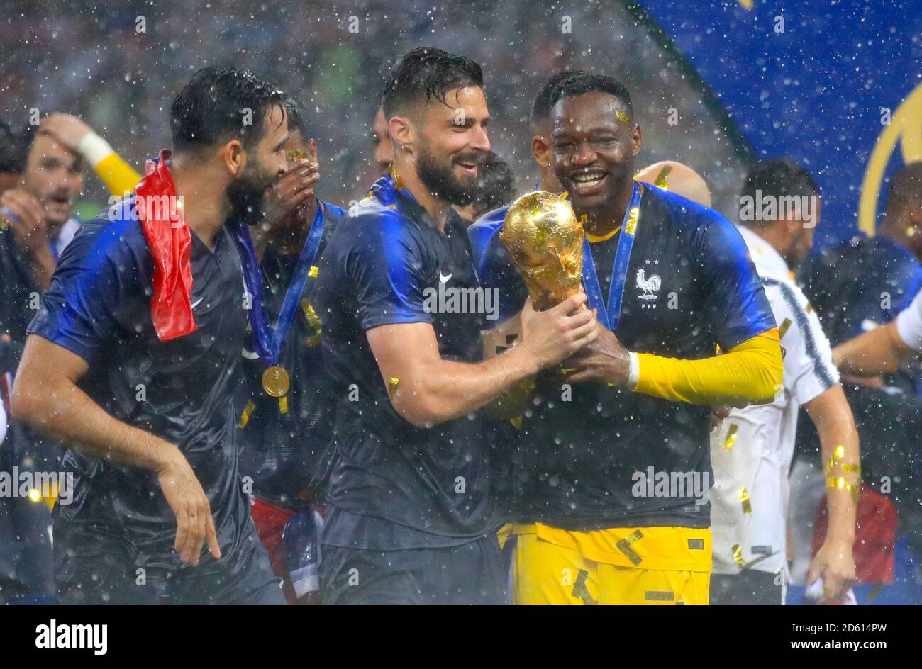 France's Olivier Giroud (centre) and Steve Mandanda celebrate with the trophy after France win the FIFA World Cup 2018 Stock Photo