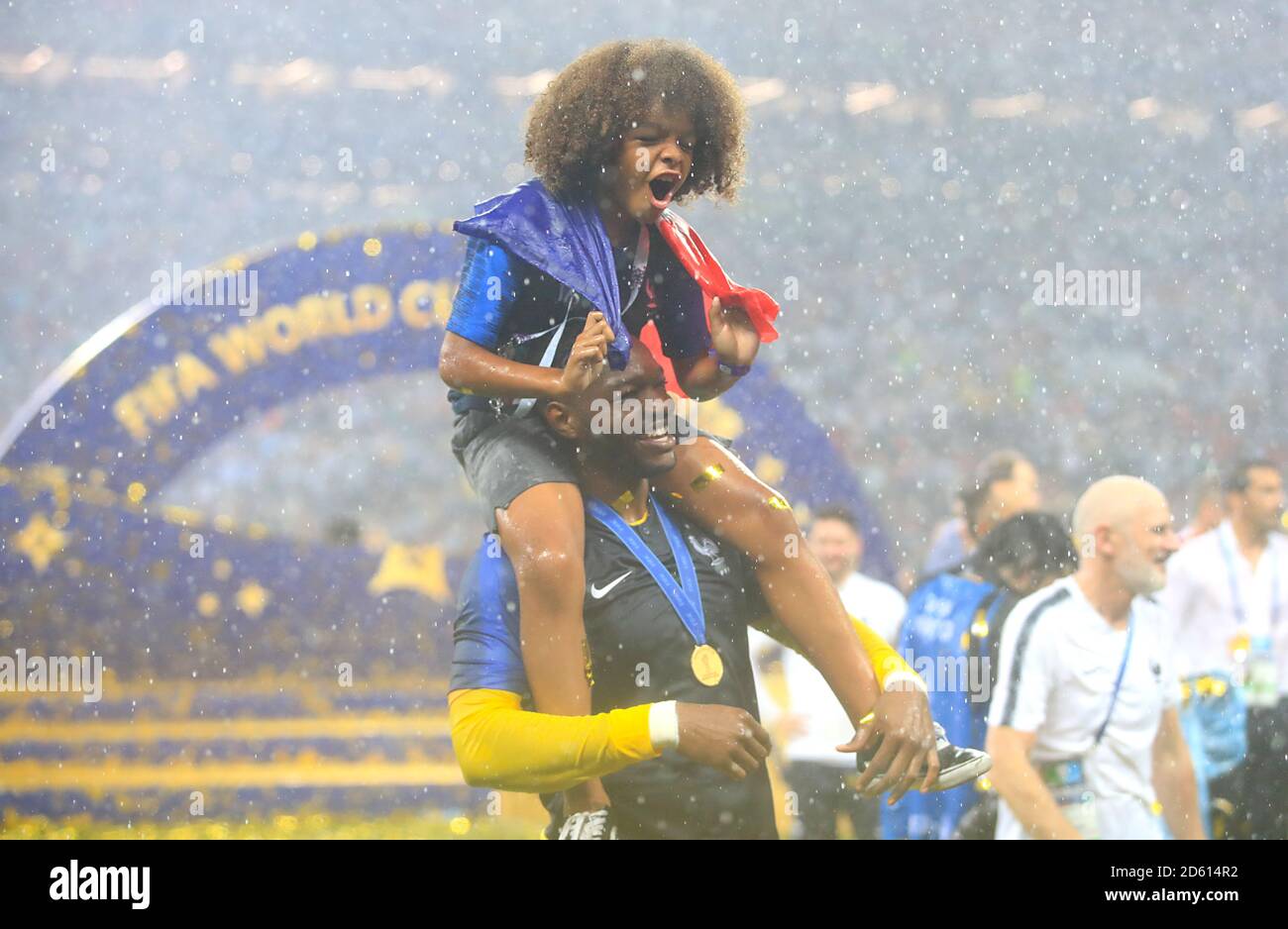 France goalkeeper Steve Mandanda celebrates with his son after France win the FIFA World Cup 2018 Stock Photo