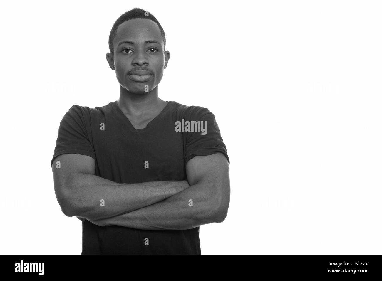 Portrait of young handsome African man with arms crossed Stock Photo ...