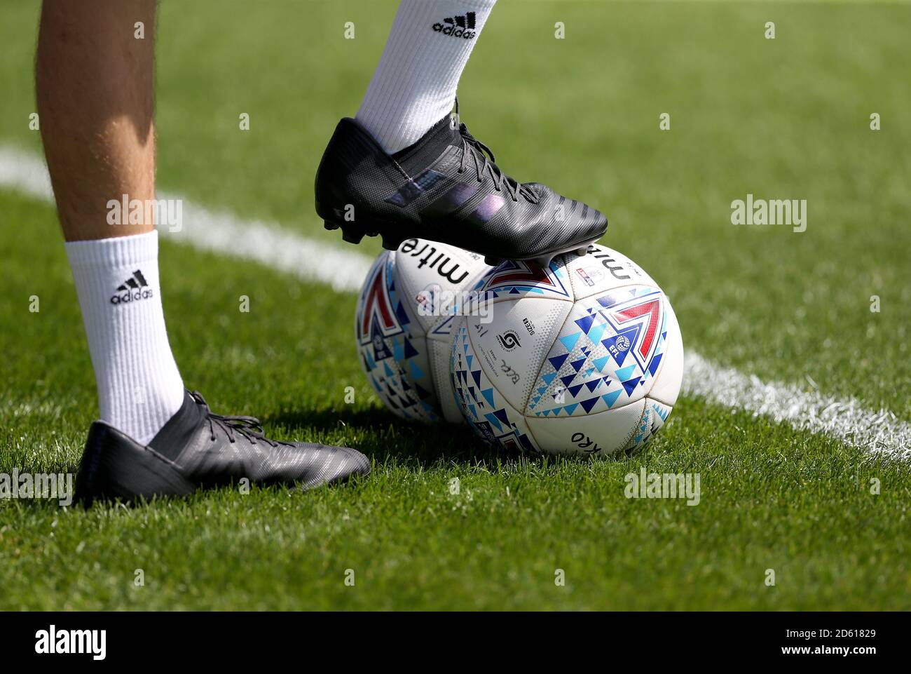 A detail view of a mitre football and adidas football boots and socks prior  to kick-off Stock Photo - Alamy
