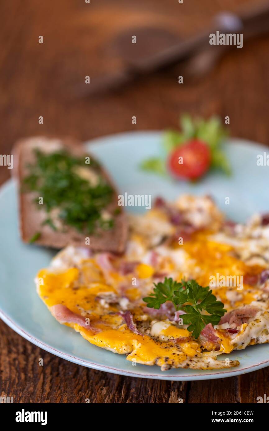 scrambled eggs on a blue plate Stock Photo