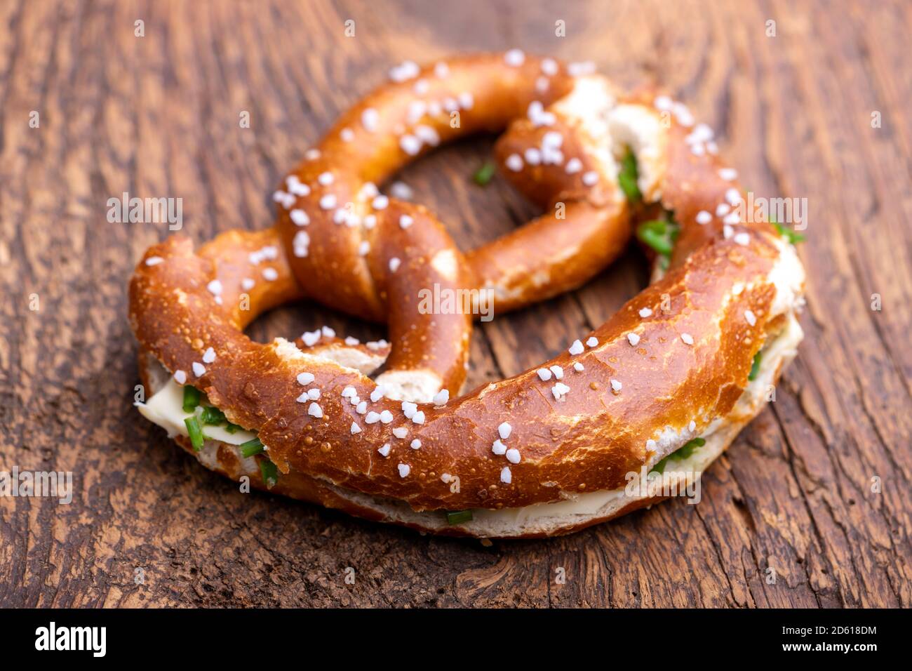 bavarian pretzel with butter on wood Stock Photo