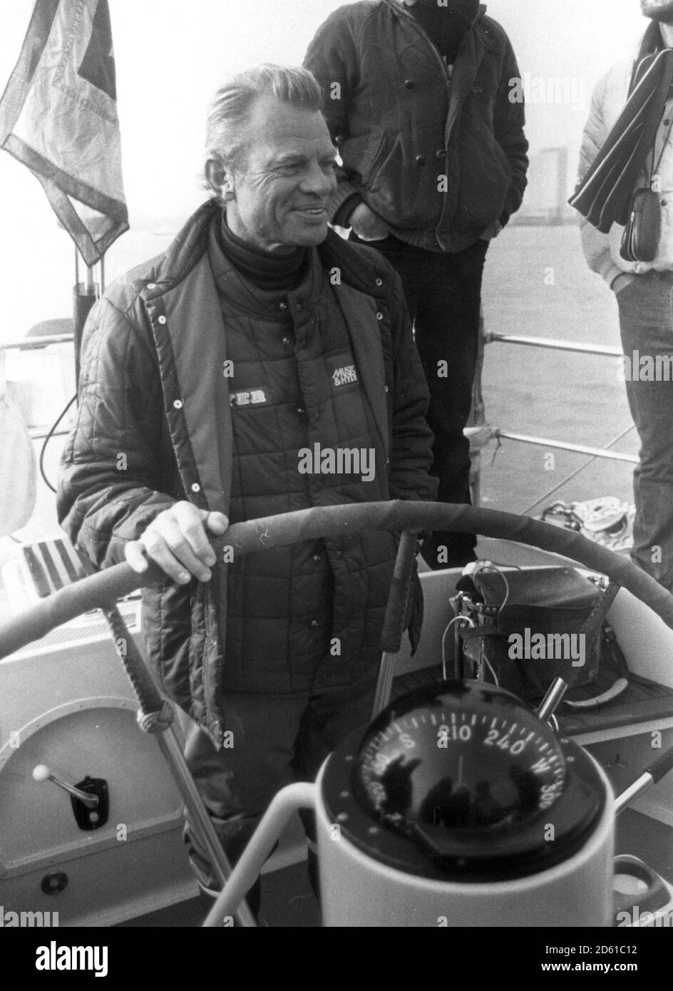 SKIPPER OF FLYER WHICH WON THE 1981 ROUND THE WORLD YACHT RACE        CORNELIUS VAN RIETSCHOTEN STEERS THE YACHT ACROSS THE FINISHING LINE. Stock Photo