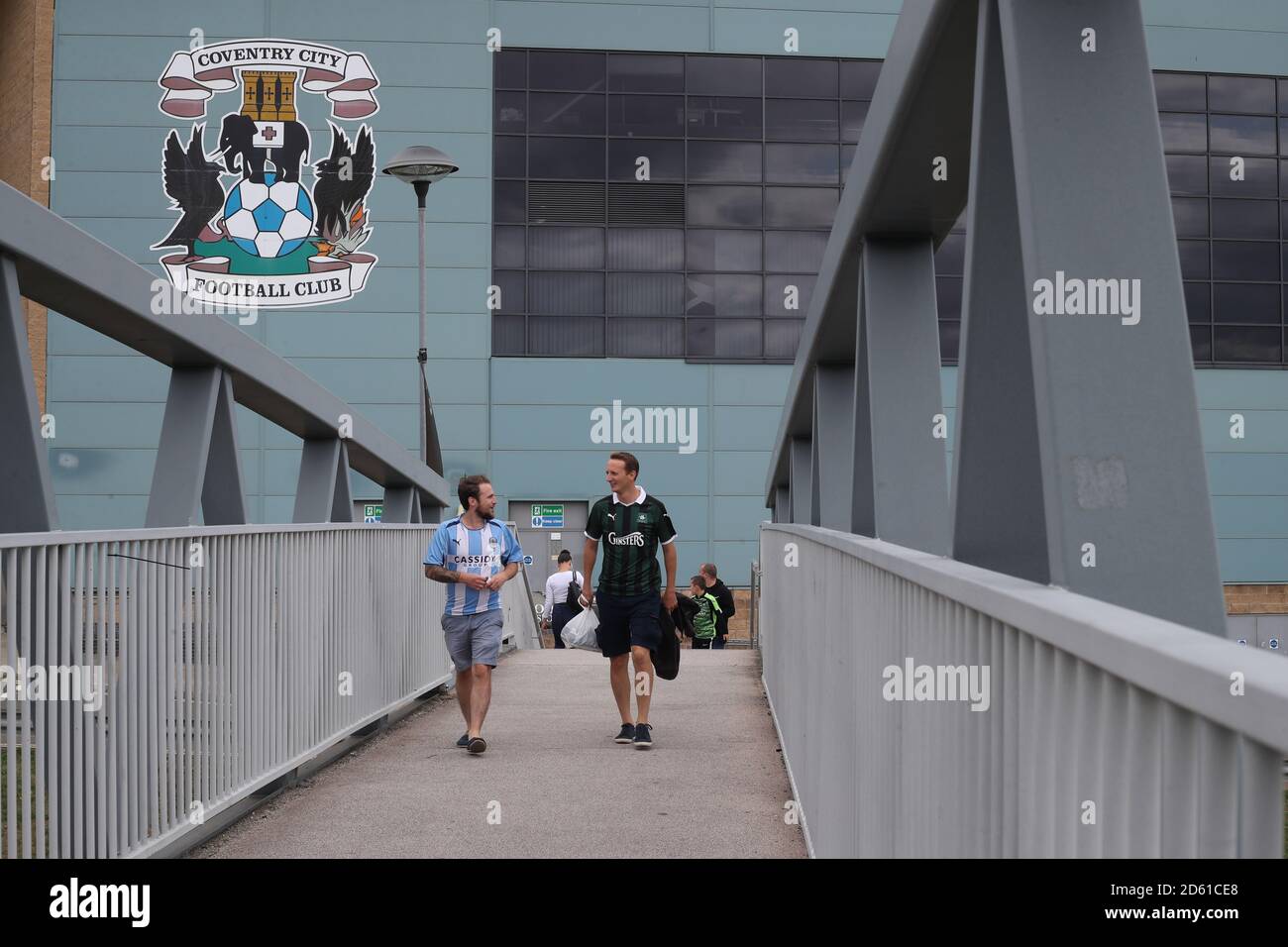 Fans make their way to the Ricoh Arena ahead of the Sky Bet League One match Stock Photo