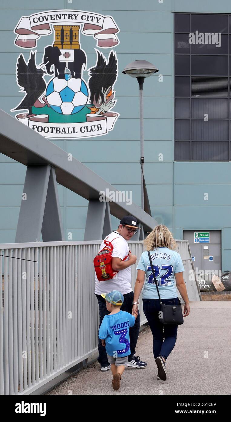 Fans make their way to the Ricoh Arena ahead of the Sky Bet League One match Stock Photo