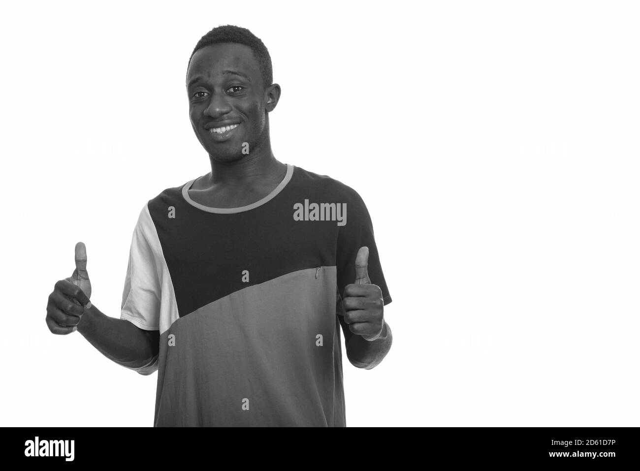 Young happy African man smiling and giving thumbs up Stock Photo - Alamy