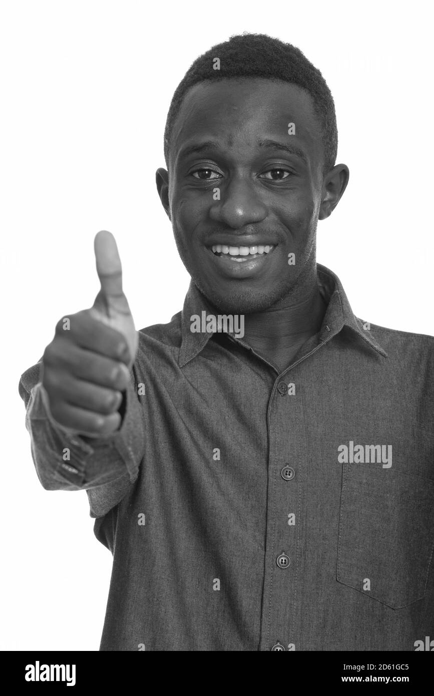 Young happy African man smiling and giving thumb up Stock Photo - Alamy