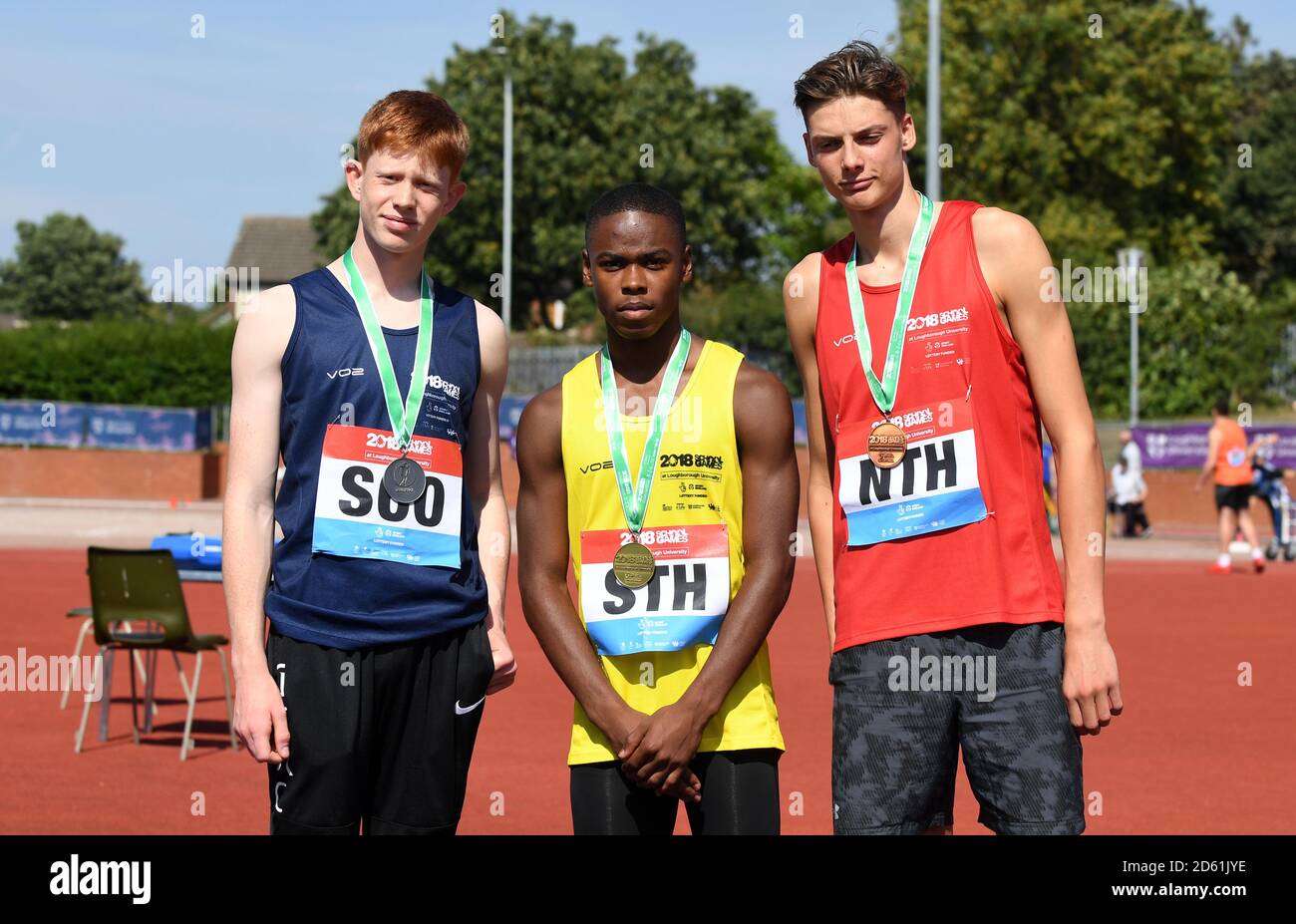 (Left to right) Silver medalist Scotland's Reuben Nairne, Gold medalist England South's Joseph Harding and Bronze medalist England North's Ewan Bradley in the Mens 100m Hurdles during day two of the athletics at the 2018 School Games held at Loughborough University. Stock Photo