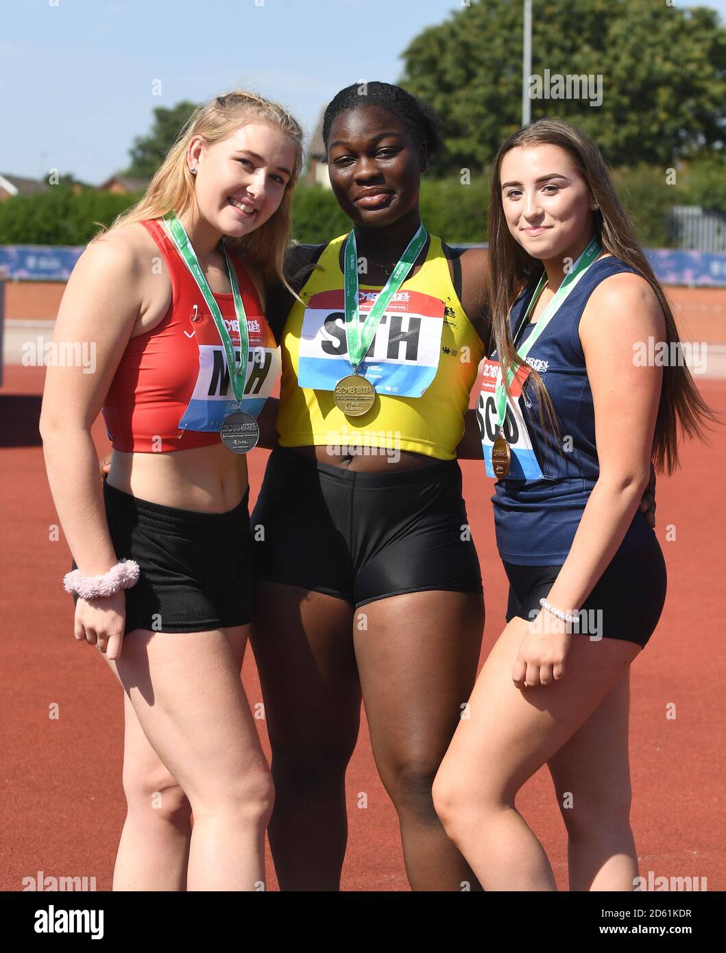 (left to right) Silver medalist England North's Kelsey Pearce, Gold medalist England South's Nana Gyedu and Bronze medalist Scotland's Hayley Berry in the girls shot put during day two of the athletics at the 2018 School Games held at Loughborough University. Stock Photo