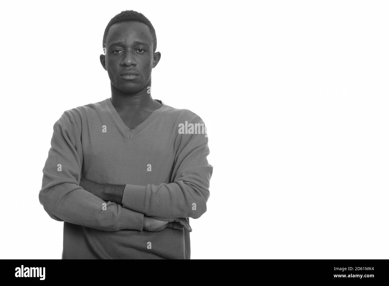 Portrait of young African man with arms crossed Stock Photo - Alamy