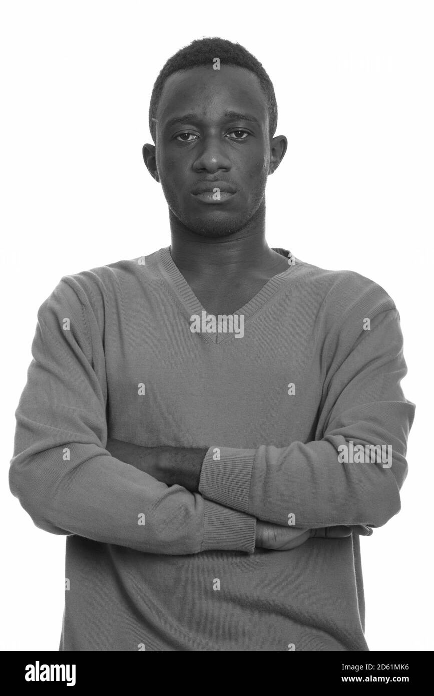 Portrait of young African man with arms crossed Stock Photo - Alamy